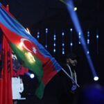 Azerbaijan sets flag on fire during weightlifting