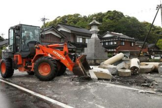 Aftershocks shake Japan after earthquake kills one,