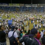 At least 9 dead in stampede at football stadium in