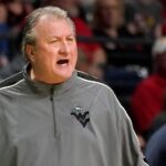 Bob Huggins pay cut after homophobic remark