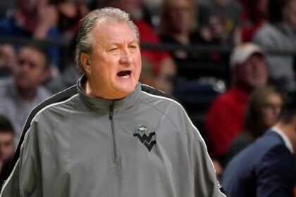 Bob Huggins pay cut after homophobic remark