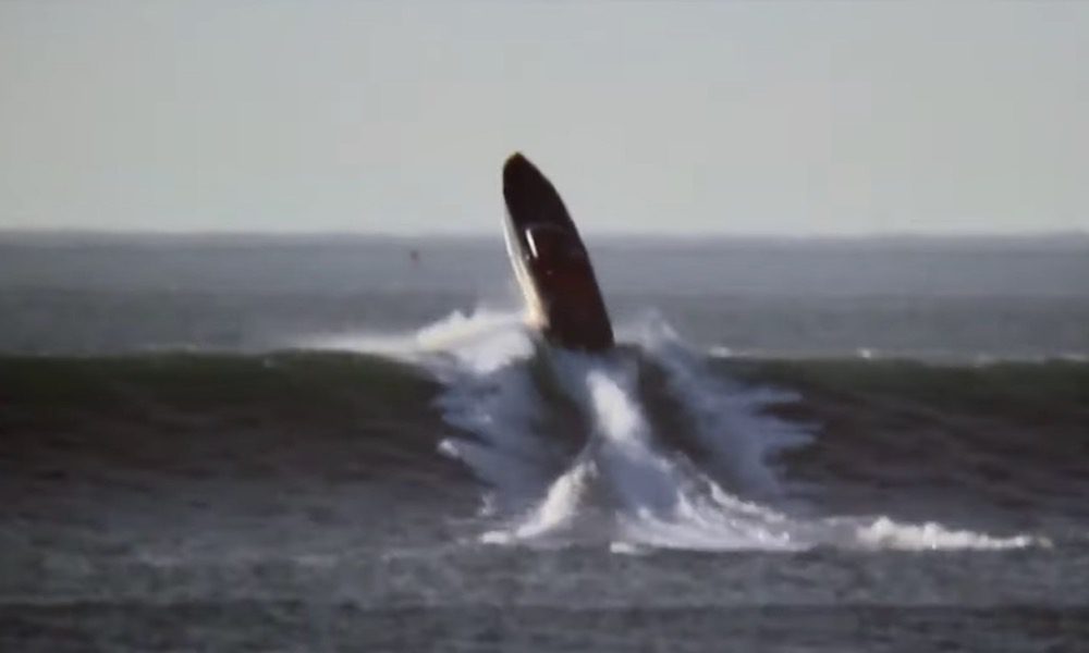 Cigarette boat takes on a huge surf and it doesn’t