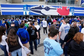 Mystery Blue Jays fan wins .8 million.  Organizers