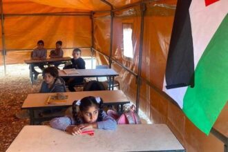 Palestinian students study in tents after school