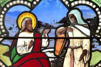 Stained glass window depicts Jesus Christ with